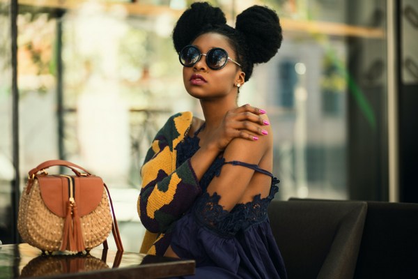 girl wearing blue dress yellow cardigan