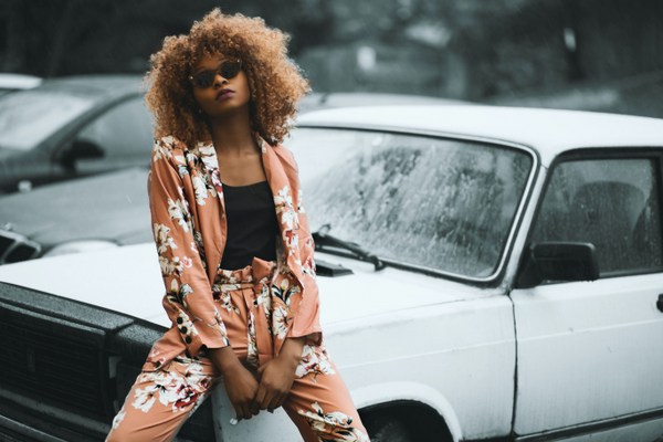 woman wearing floral brown trouser suit